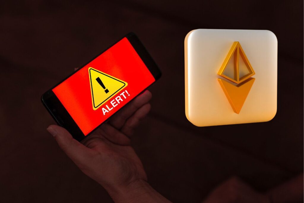 ethereum alert hand holding mobile